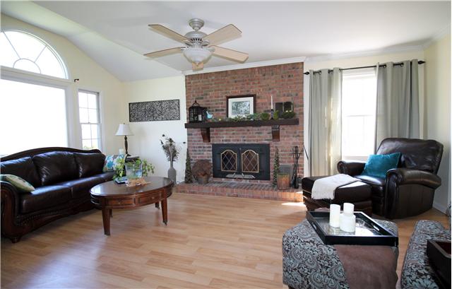 5902 Parham Road Franklin, TN 37064 - Photo 9 of 20 a living room with furniture and a fireplace