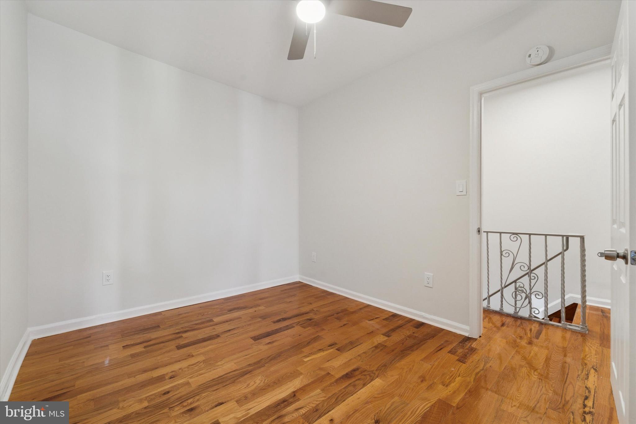 3052 Aramingo Avenue Philadelphia, PA 19134 - Photo 15 of 24 a view of empty room with wooden floor