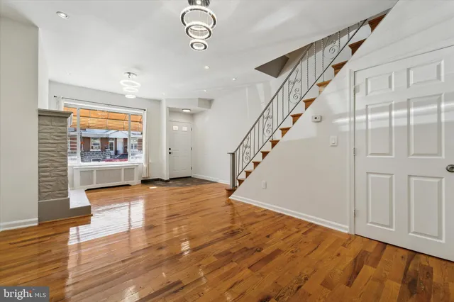 a view of an entryway with wooden floor