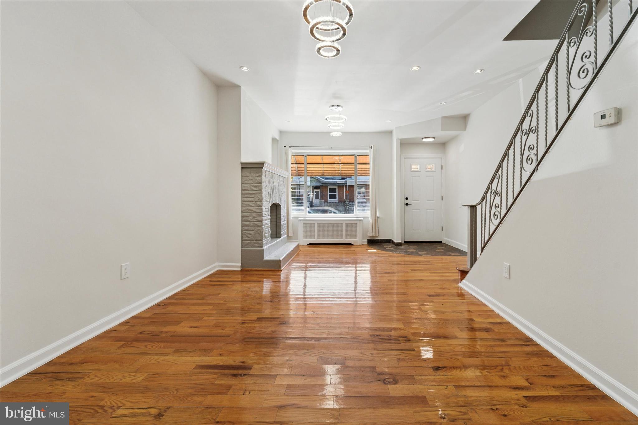 3052 Aramingo Avenue Philadelphia, PA 19134 - Photo 6 of 24 a view of empty room with wooden floor