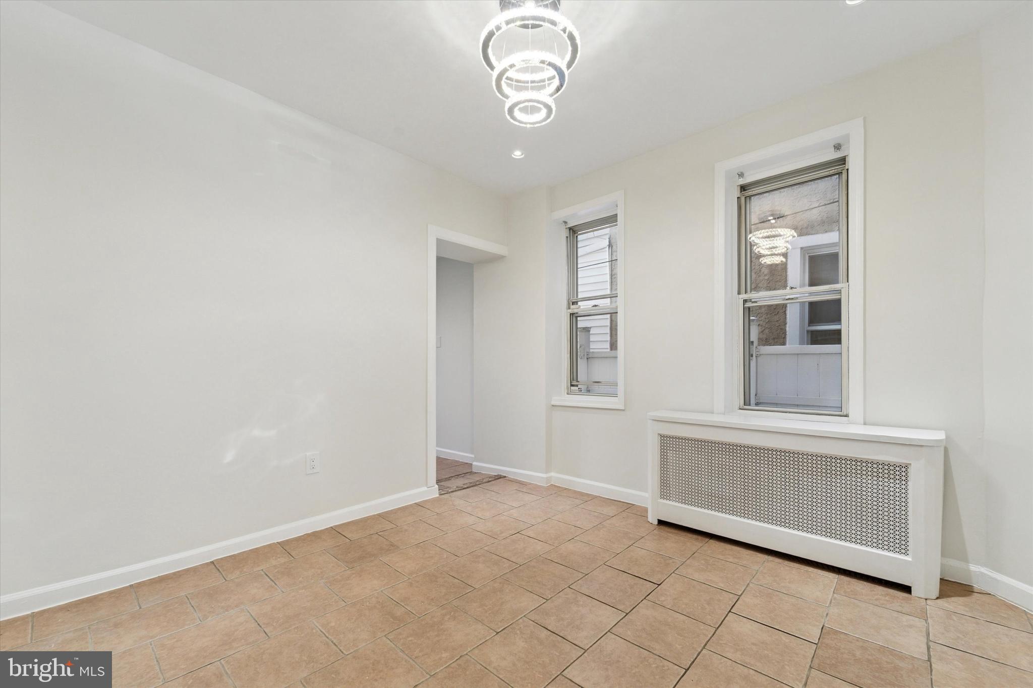 3052 Aramingo Avenue Philadelphia, PA 19134 - Photo 7 of 24 an empty room with windows