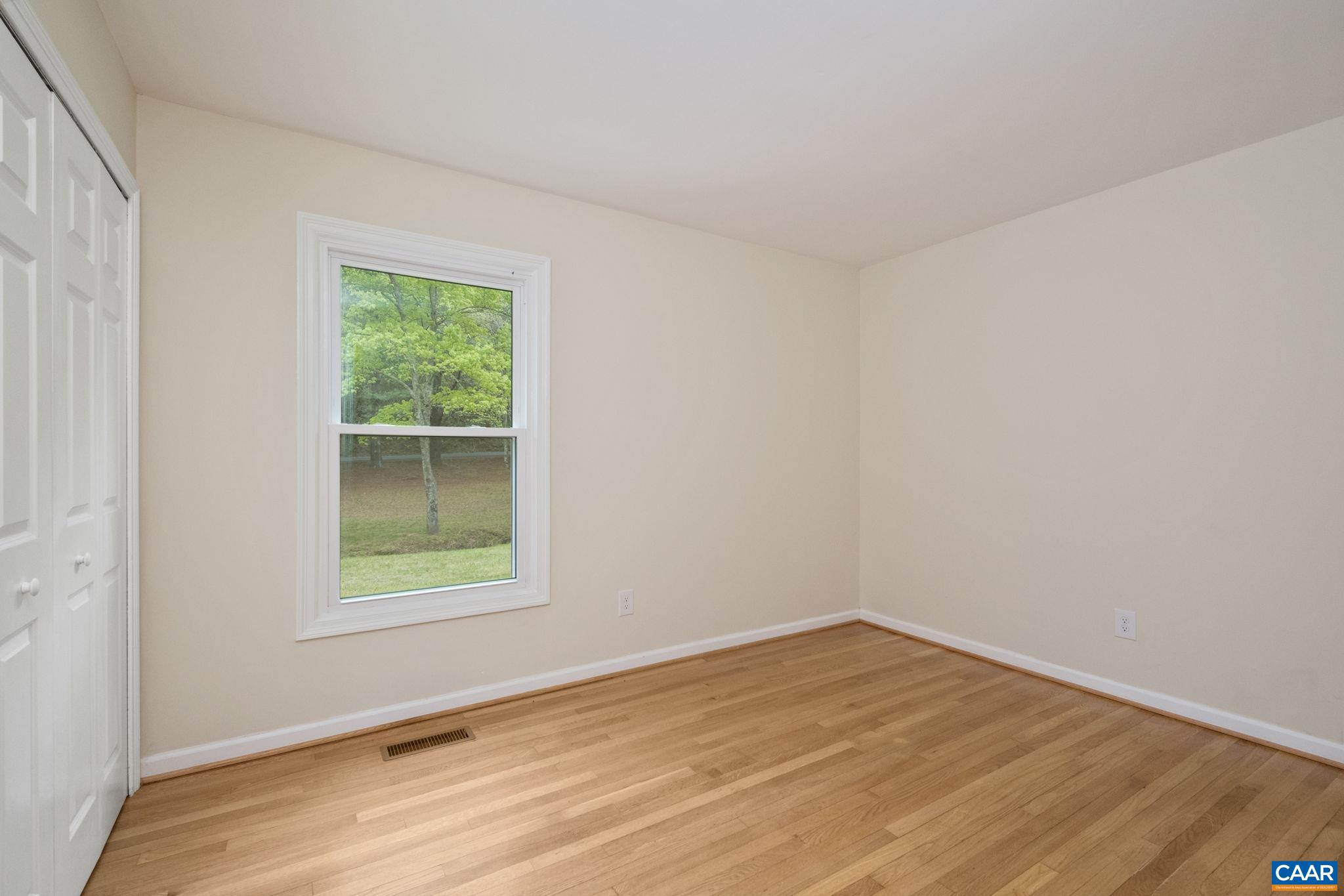 1680 Craigs Store Road Afton, VA 22920 - Photo 32 of 57 an empty room with wooden floor and windows