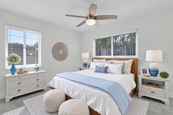 a bedroom with a bed and a window