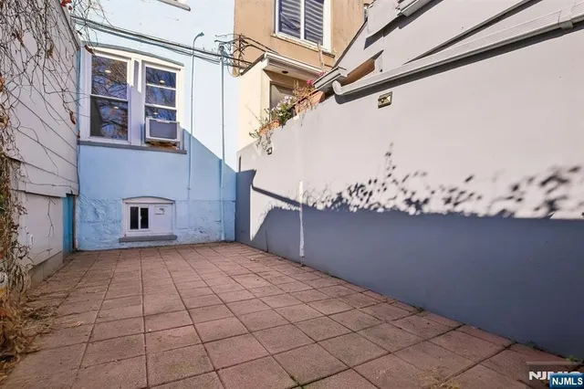 a view of a house with a potted plant
