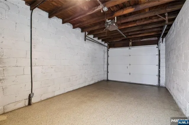 a view of a house with a snow on the road