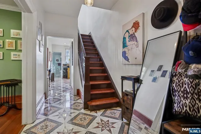 a very nice looking room with many windows and furniture