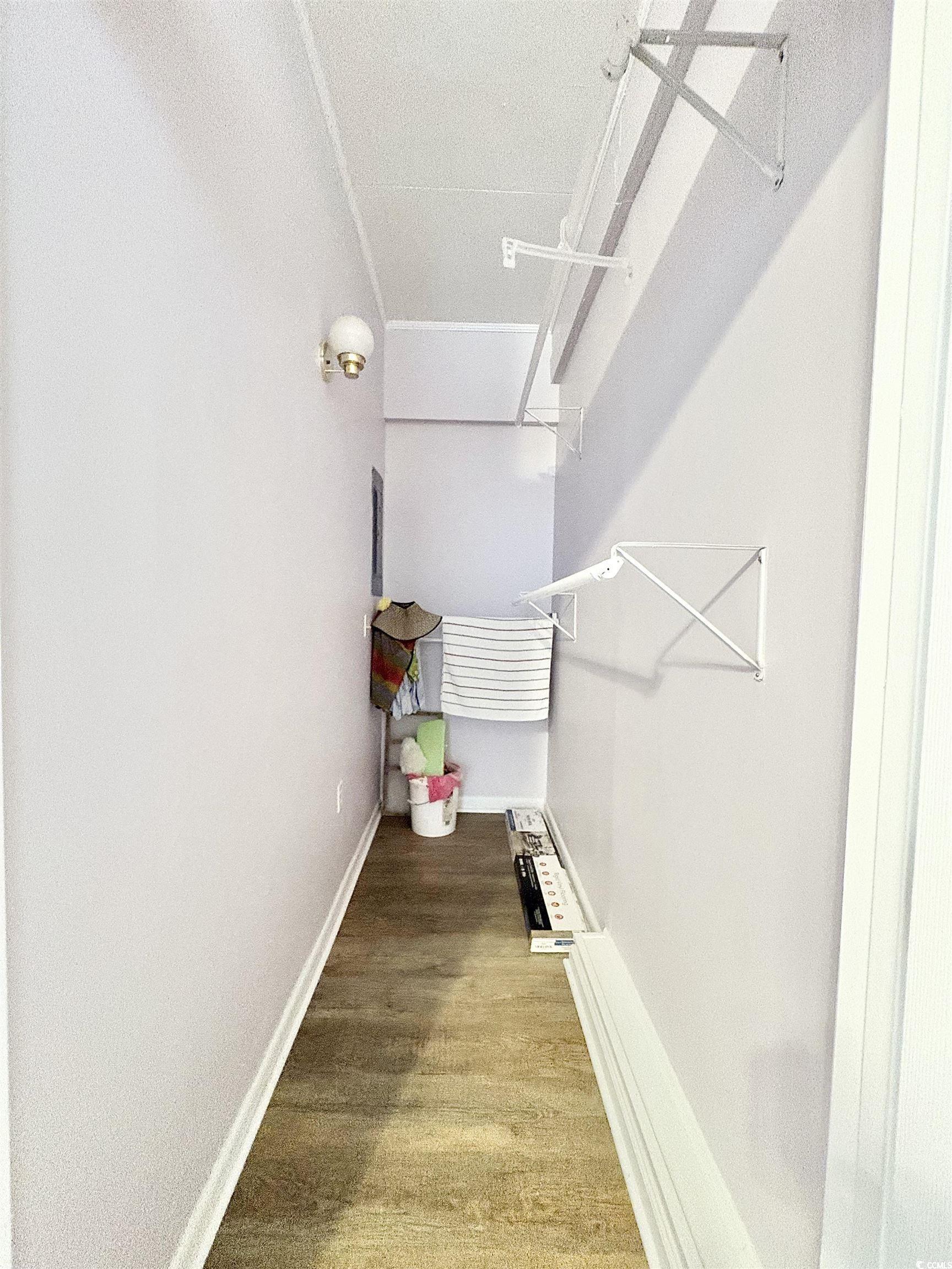 703 62nd Avenue North Myrtle Beach, SC 29577 - Photo 16 of 20 Walk in closet with light wood-type flooring