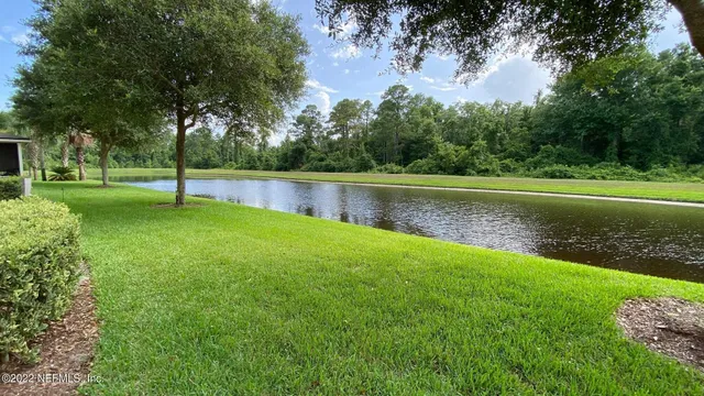 a view of a lake with a big yard
