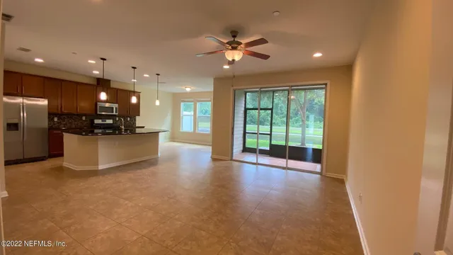 a view of a kitchen with a sink and a window