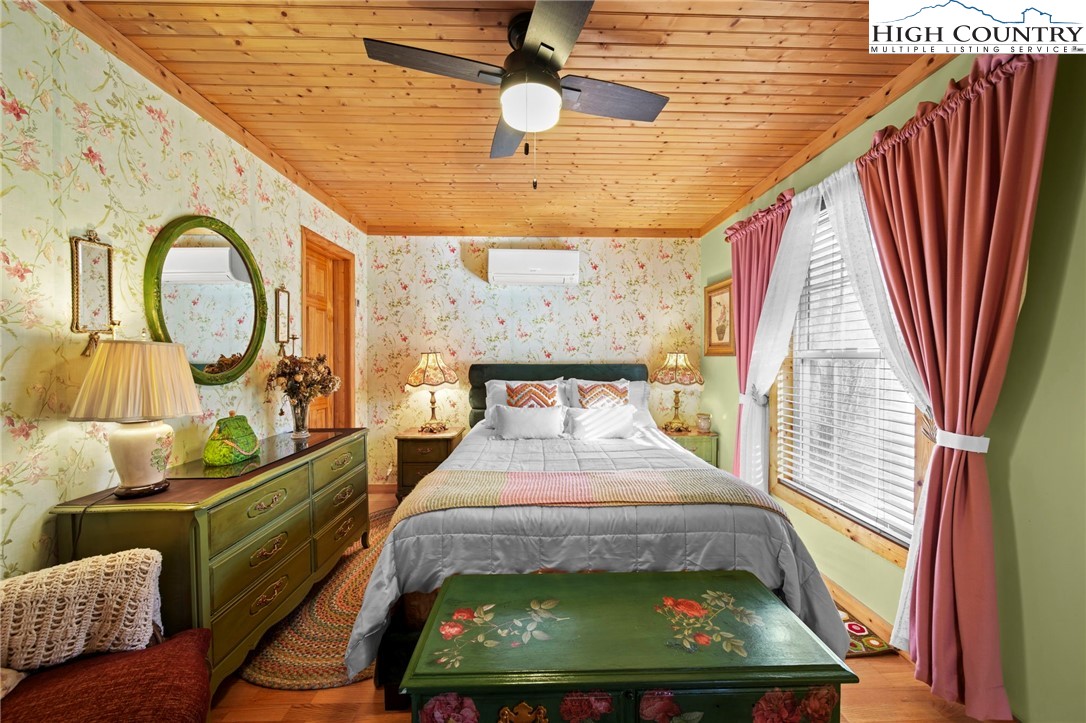 1902 Brown Road Sparta, NC 28675 - Photo 24 of 32 a bed room with furniture and a window