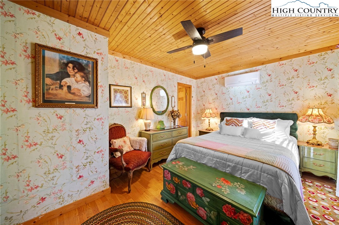 1902 Brown Road Sparta, NC 28675 - Photo 25 of 32 a bedroom with a bed and wooden floor