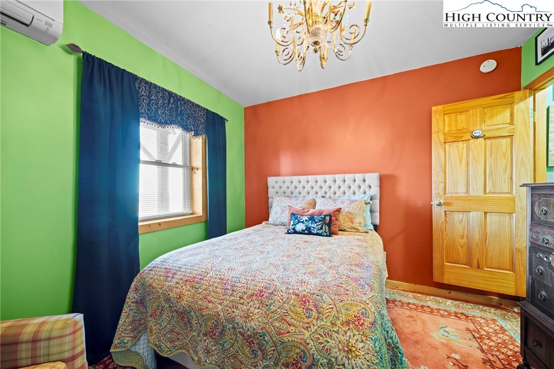 1902 Brown Road Sparta, NC 28675 - Photo 31 of 32 a bedroom with a bed and a window