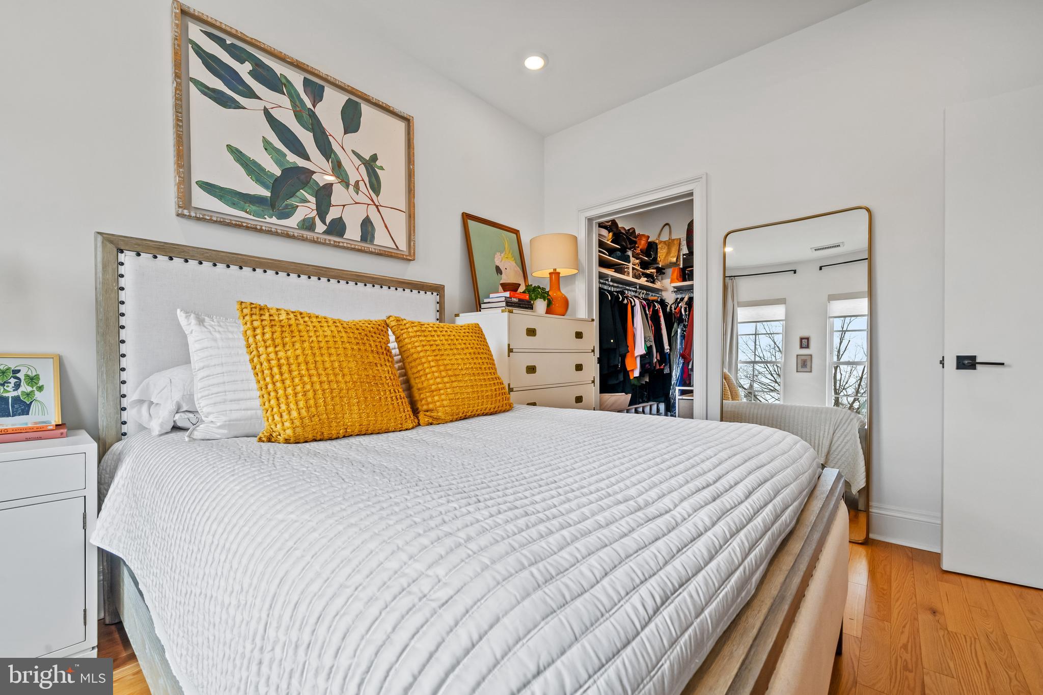 300 8th Street Northeast, Unit 307 Washington, DC 20002 - Photo 19 of 36 a bedroom with a bed and wooden floor