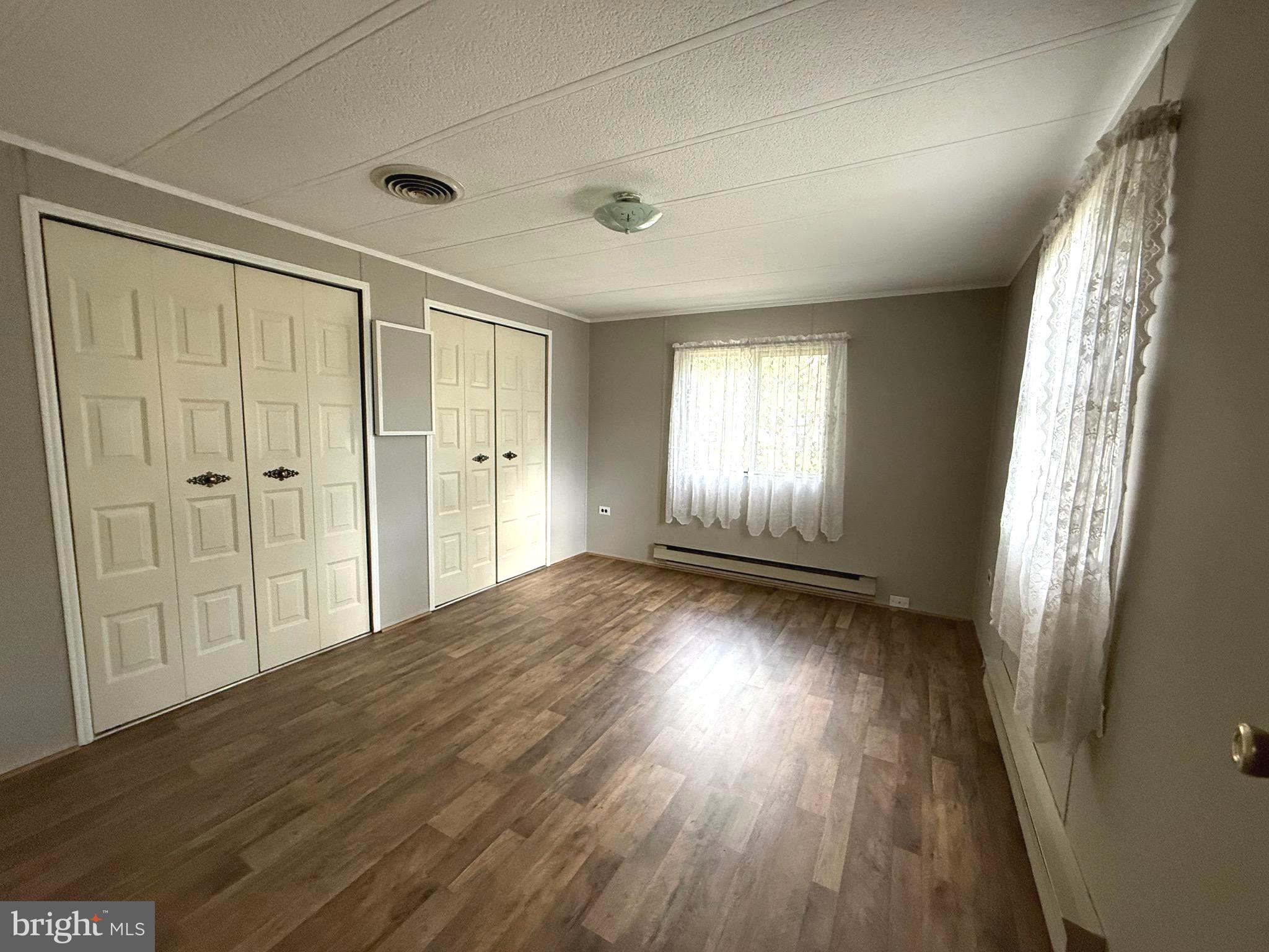 87 Holly Court Tabernacle, NJ 08088 - Photo 15 of 24 an empty room with wooden floor and windows