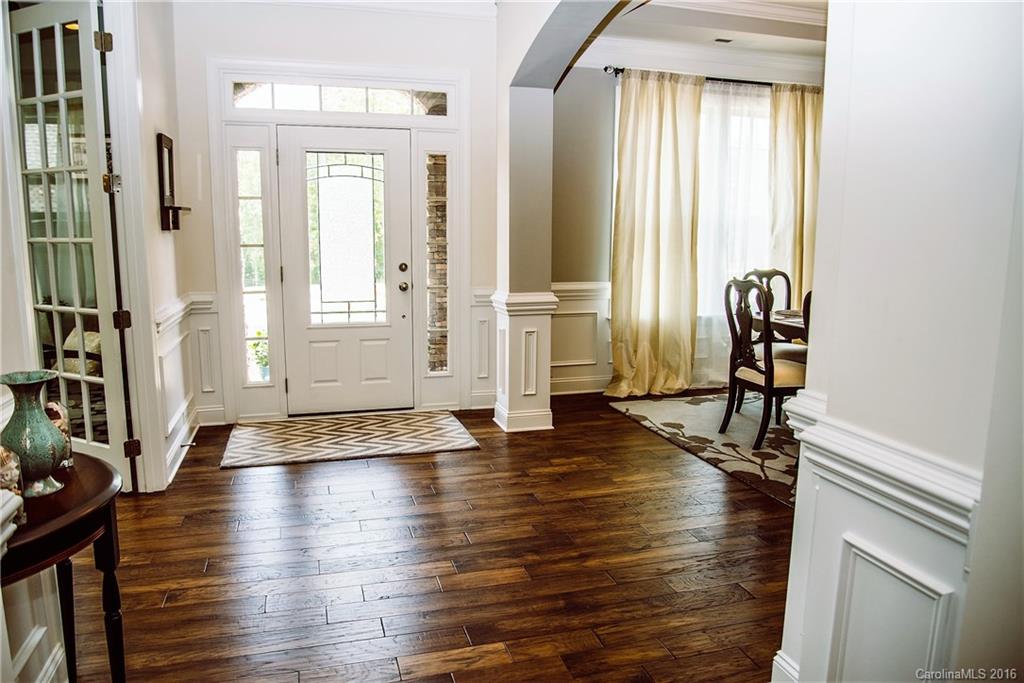 8086 Clems Branch Road Indian Land, SC 29707 - Photo 2 of 23 an empty room with wooden floor and windows
