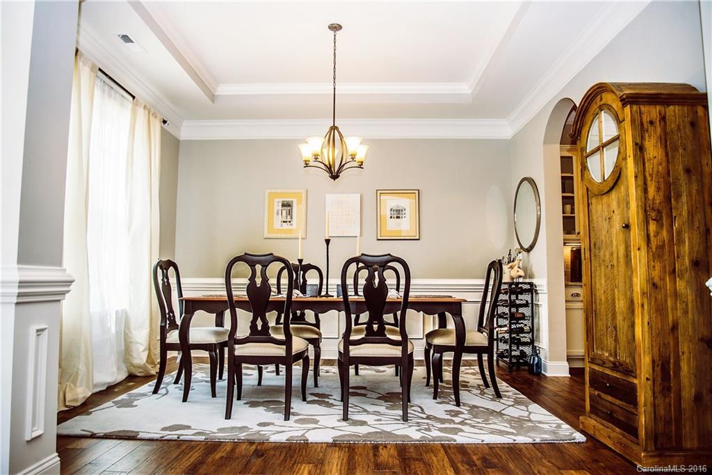 8086 Clems Branch Road Indian Land, SC 29707 - Photo 12 of 23 a view of a dining room with furniture window and wooden floor