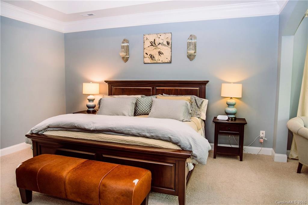 8086 Clems Branch Road Indian Land, SC 29707 - Photo 14 of 23 a bedroom with a bed and a lamp