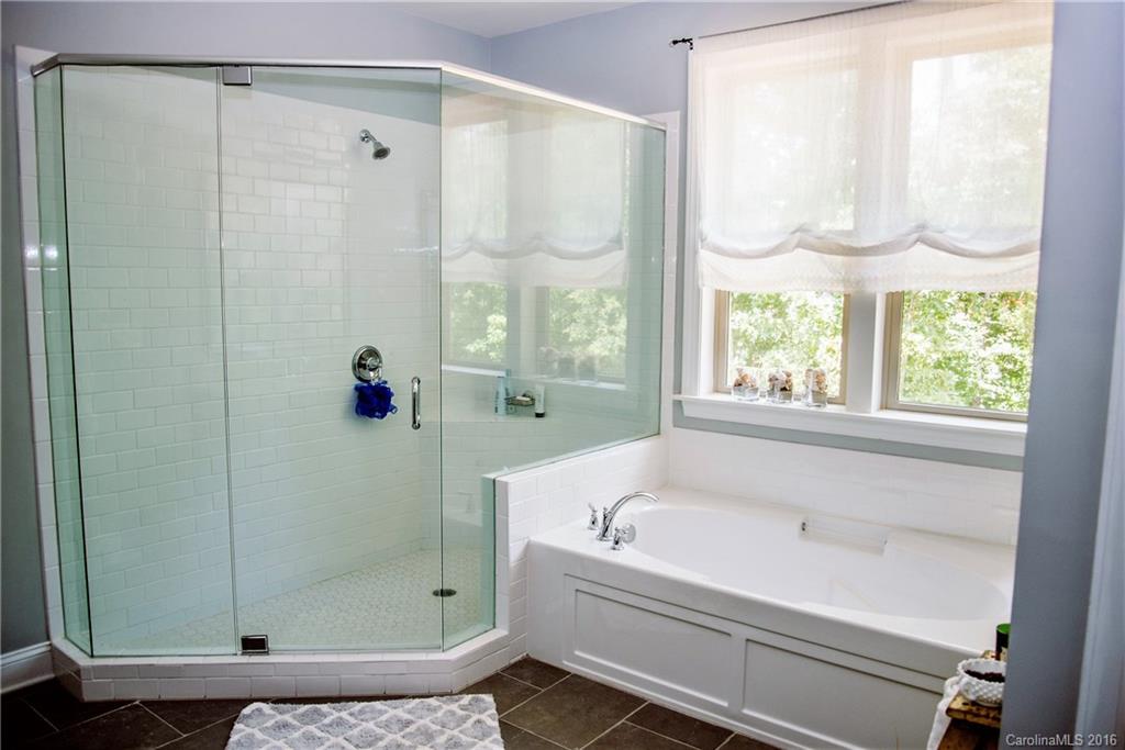 8086 Clems Branch Road Indian Land, SC 29707 - Photo 17 of 23 a bathroom with a bathtub and a shower
