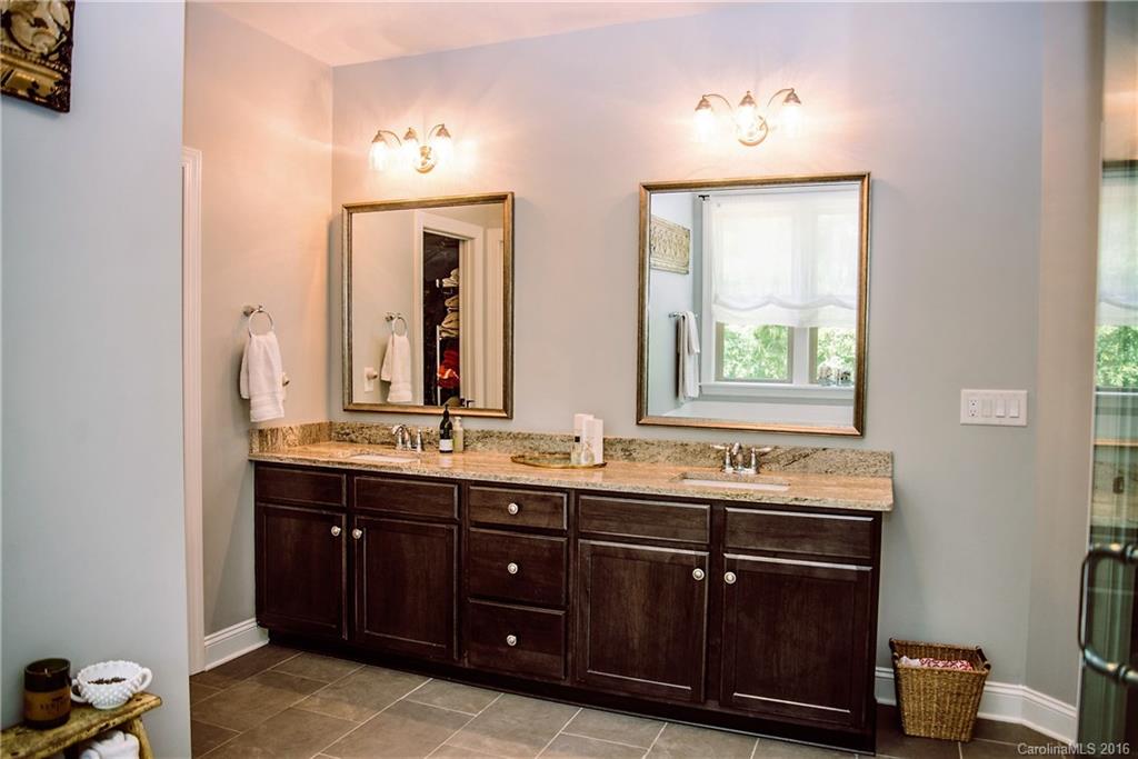 8086 Clems Branch Road Indian Land, SC 29707 - Photo 18 of 23 a bathroom with a double vanity sink and a mirror
