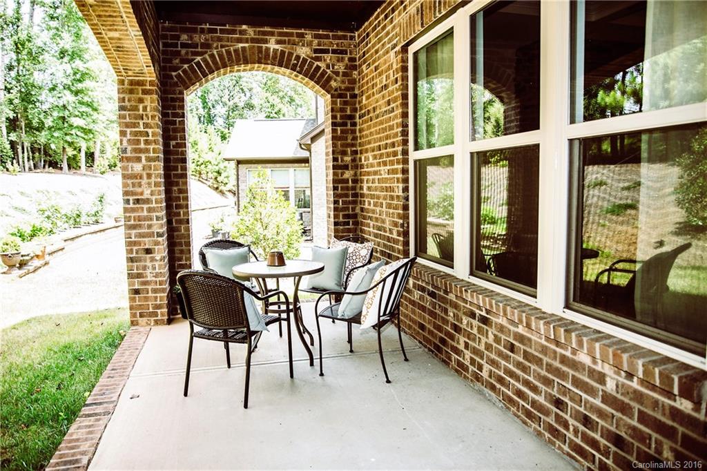 8086 Clems Branch Road Indian Land, SC 29707 - Photo 23 of 23 a view of a chairs and table in the patio with a yard