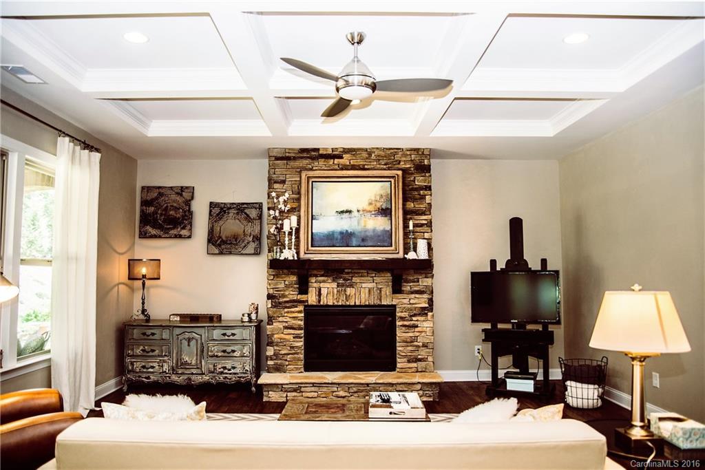 8086 Clems Branch Road Indian Land, SC 29707 - Photo 10 of 23 a living room with furniture a fireplace and a flat screen tv