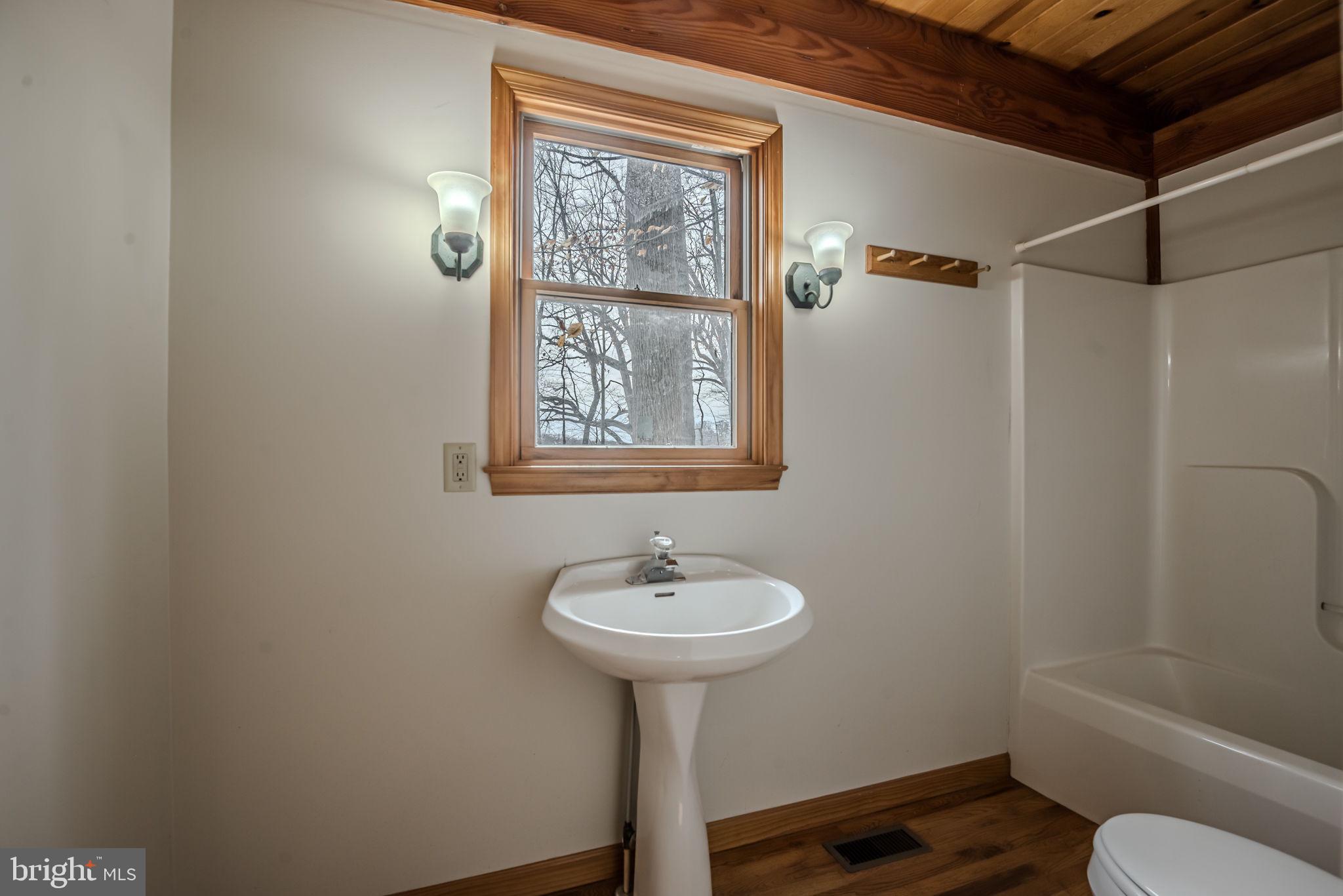 13755 Shallcross Wharf Road Kennedyville, MD 21645 - Photo 18 of 43 a bathroom with a sink toilet and a mirror