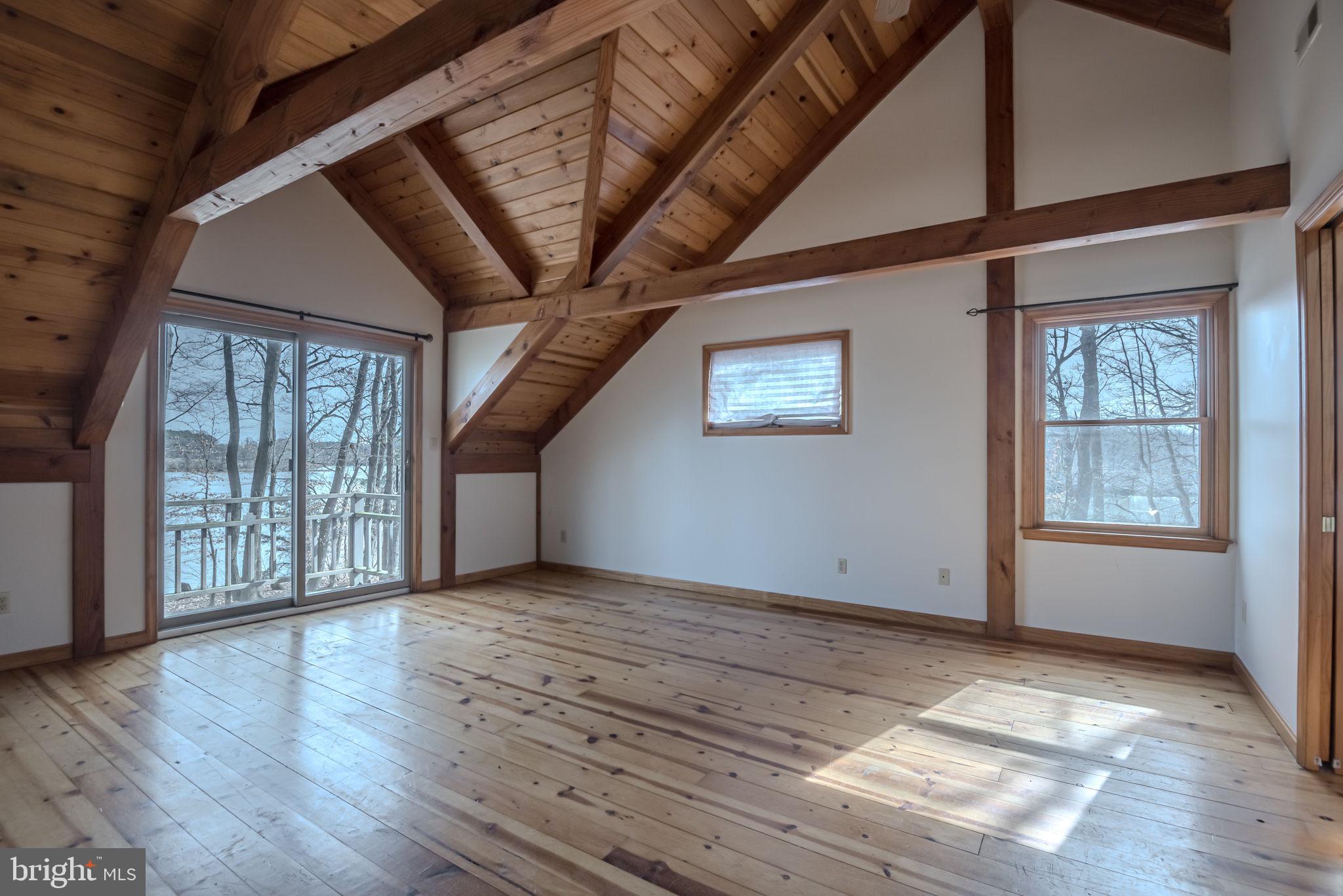 13755 Shallcross Wharf Road Kennedyville, MD 21645 - Photo 28 of 43 a view of an empty room with wooden floor and a window