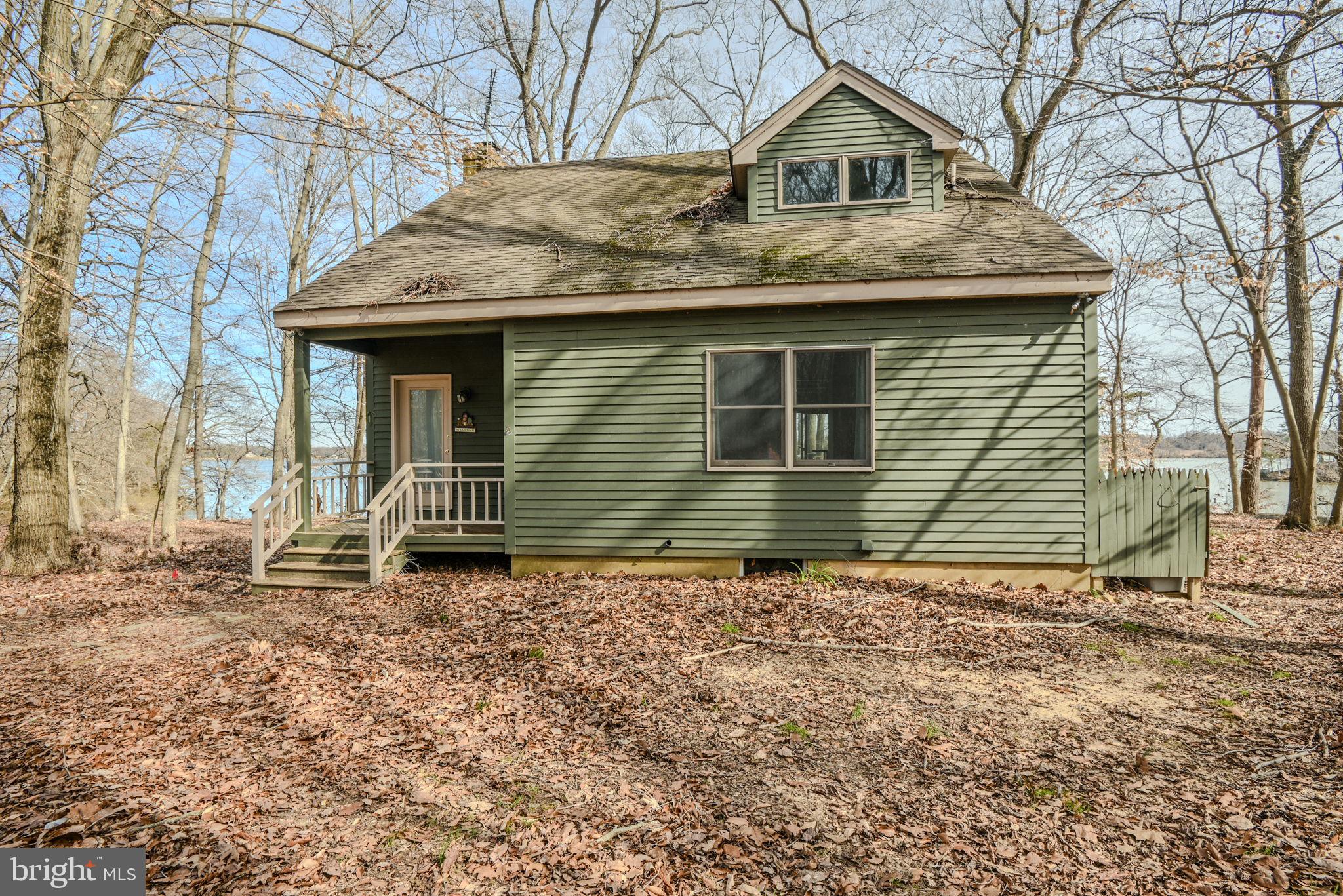 13755 Shallcross Wharf Road Kennedyville, MD 21645 - Photo 3 of 43 a house with trees in the background