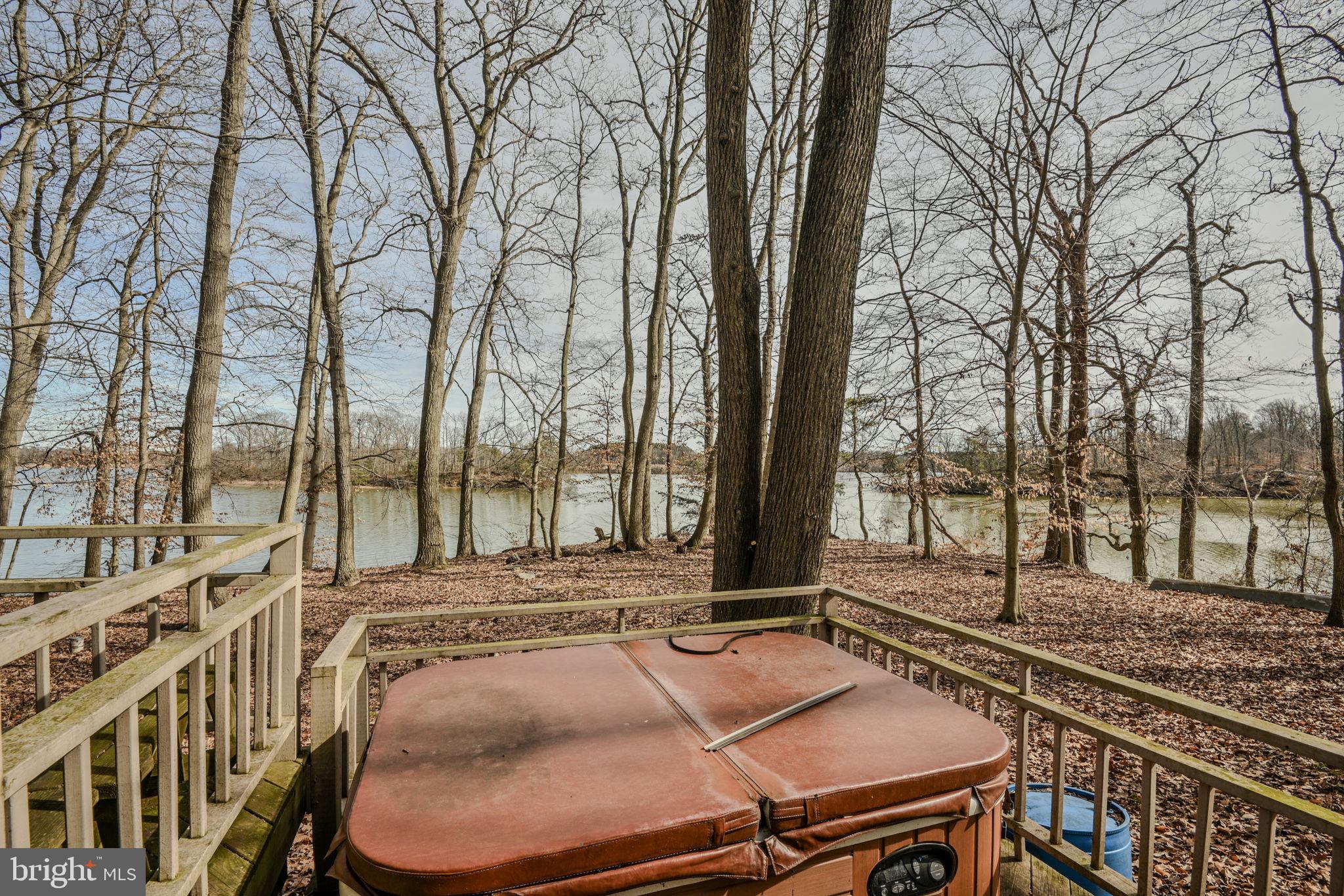 13755 Shallcross Wharf Road Kennedyville, MD 21645 - Photo 36 of 43 a backyard of a house with table and chairs