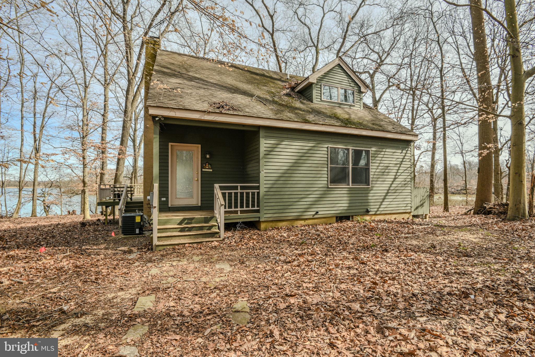 13755 Shallcross Wharf Road Kennedyville, MD 21645 - Photo 4 of 43 a front view of a house with garden
