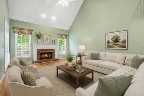a living room with furniture and a fireplace