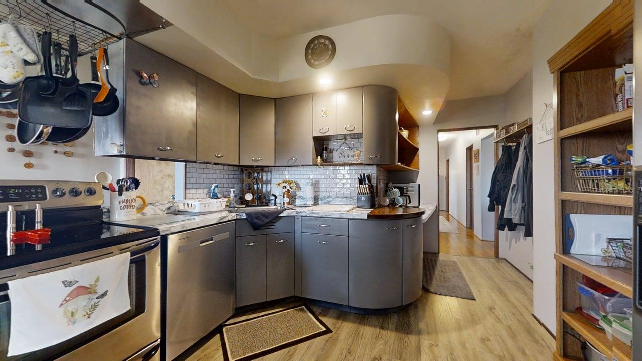 2102 County Road 2900 North Rantoul, IL 61866 - Photo 11 of 34 a kitchen with stainless steel appliances granite countertop a sink a stove and a refrigerator