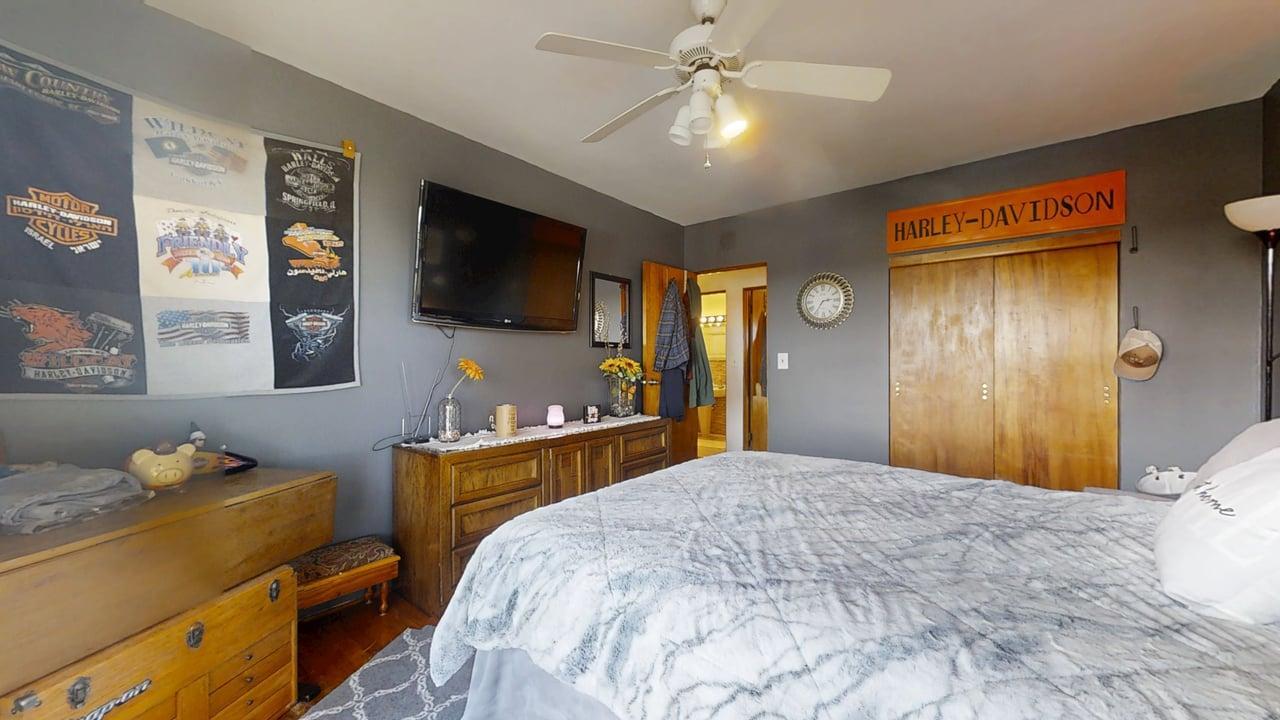 2102 County Road 2900 North Rantoul, IL 61866 - Photo 16 of 34 a bedroom with a bed and a flat screen tv