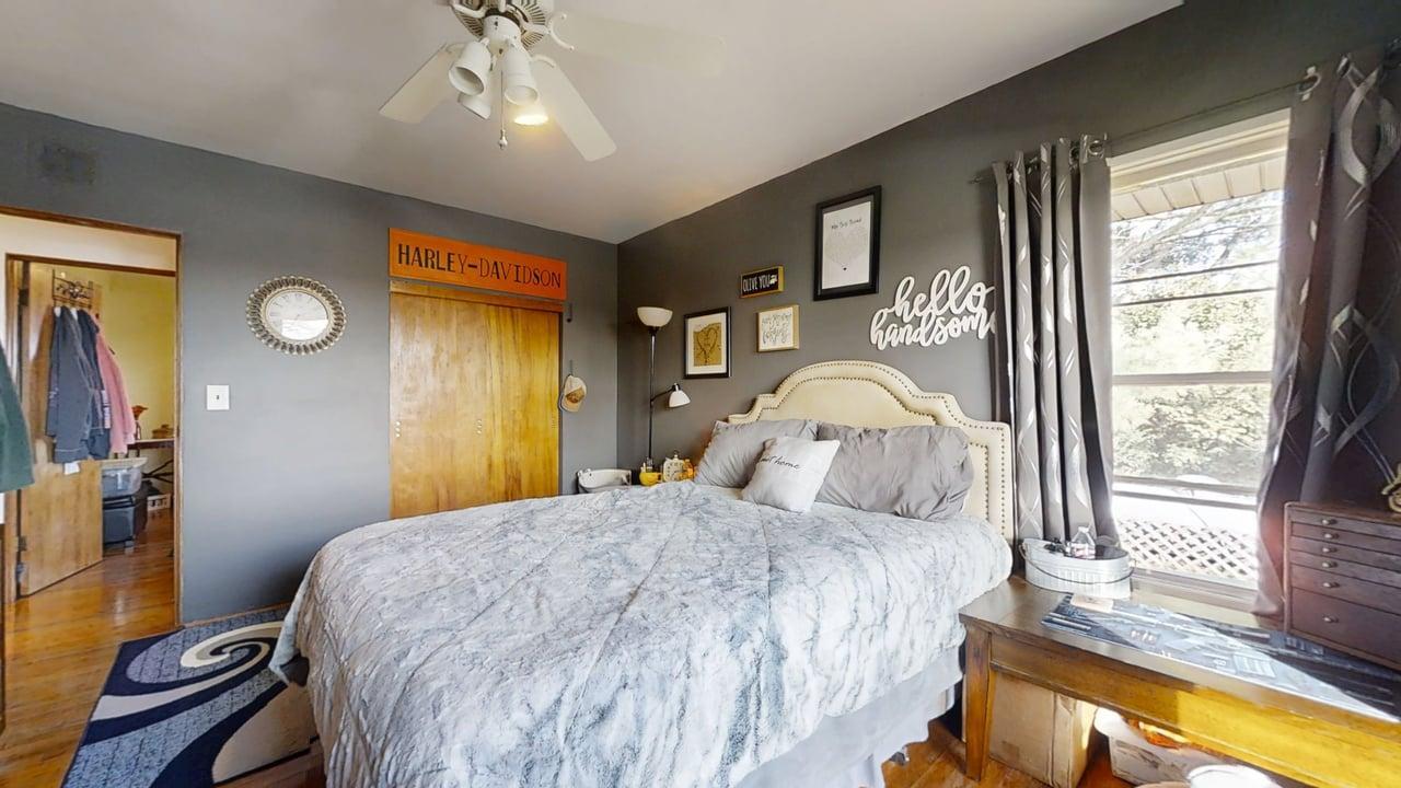 2102 County Road 2900 North Rantoul, IL 61866 - Photo 17 of 34 a bedroom with a bed and a chandelier