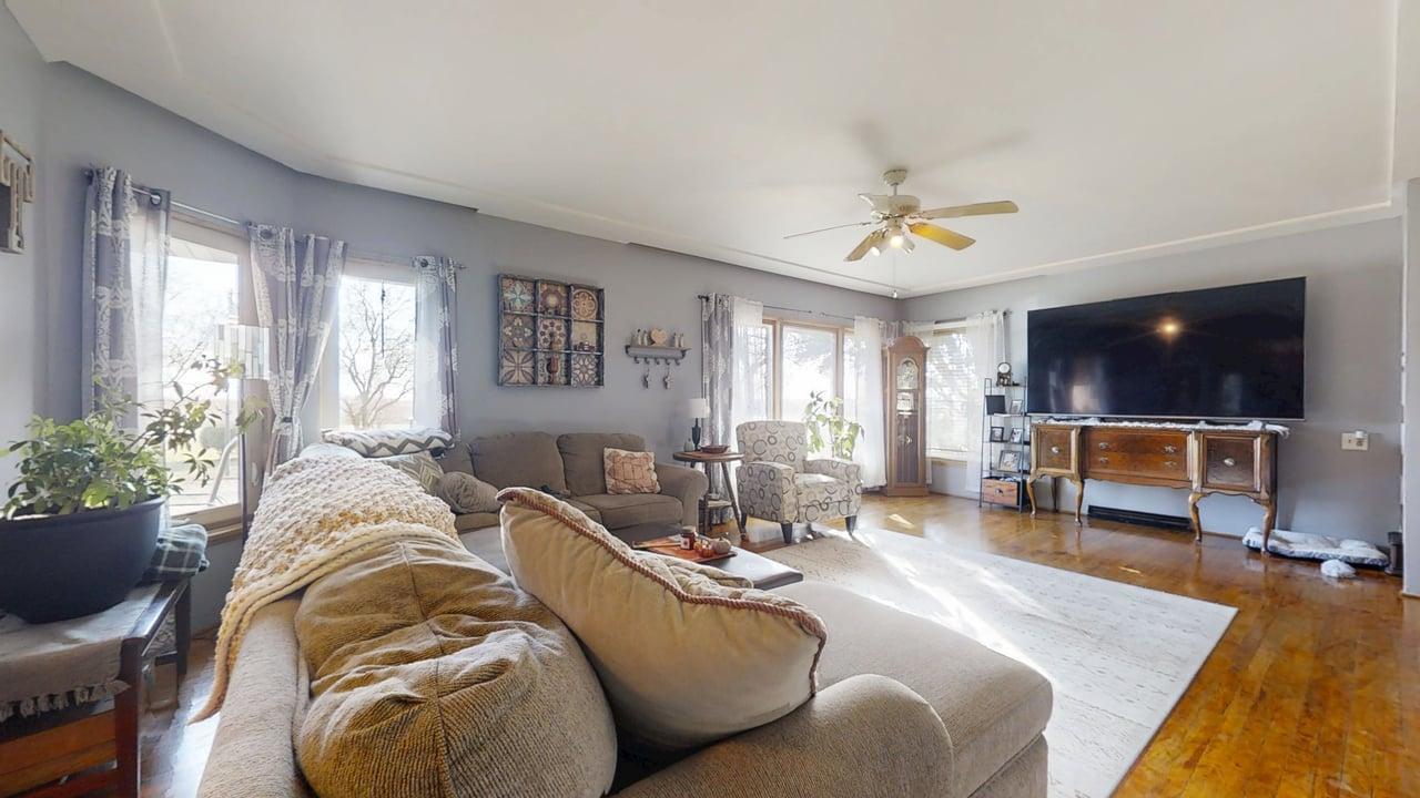 2102 County Road 2900 North Rantoul, IL 61866 - Photo 4 of 34 a living room with furniture and a flat screen tv