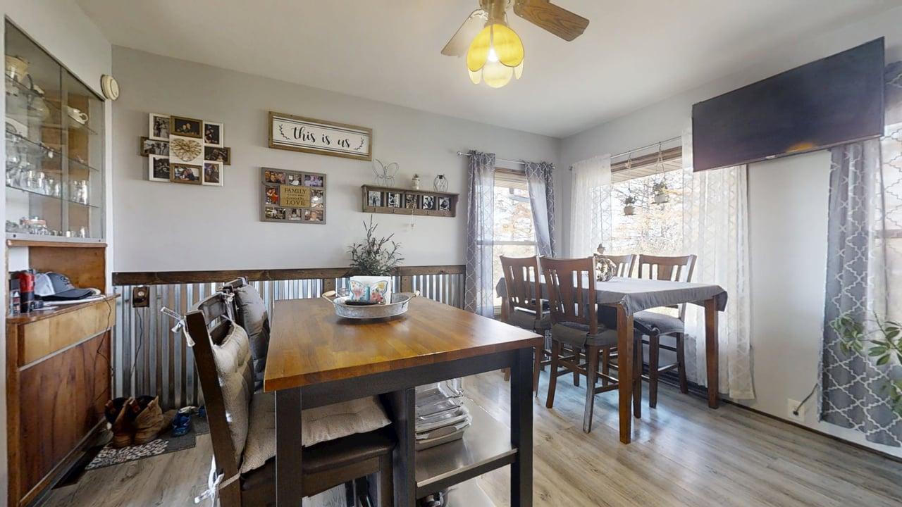 2102 County Road 2900 North Rantoul, IL 61866 - Photo 10 of 34 a view of a dining room with furniture and a chandelier