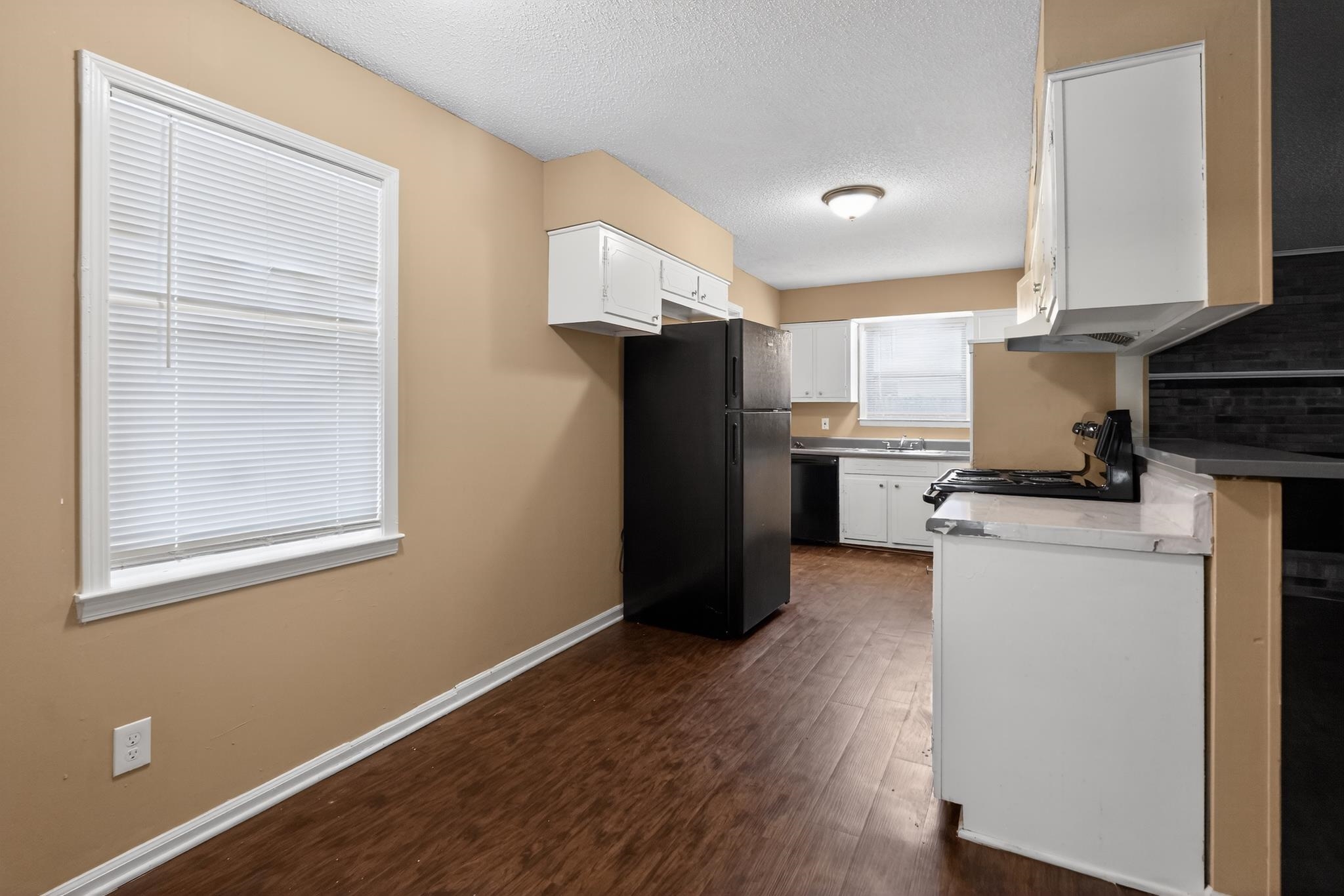 2015 East Holmes Road Memphis, TN 38116 - Photo 23 of 34 a kitchen with a refrigerator and window