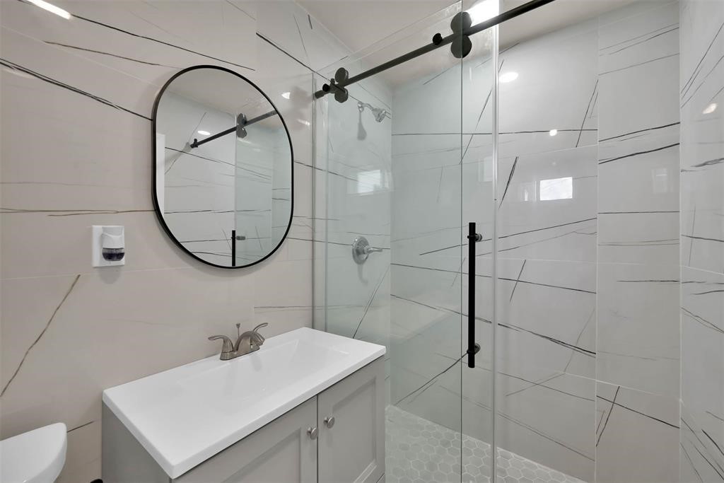 2304 Chapman Street, Unit 3 Houston, TX 77009 - Photo 16 of 17 a bathroom with a sink and a mirror