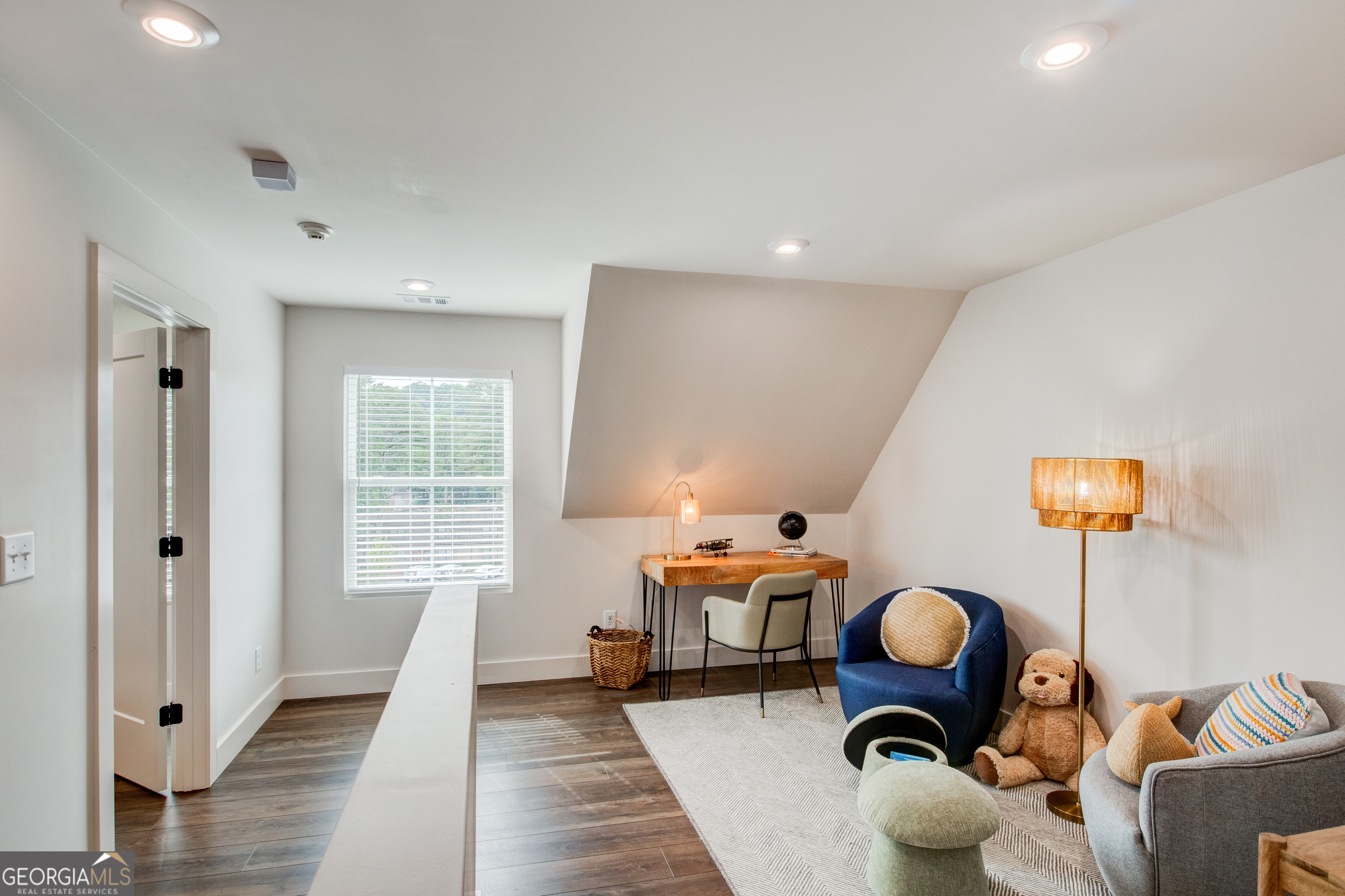 81 Chateau Drive Southeast Rome, GA 30161 - Photo 22 of 32 a living room with furniture a rug and a large window