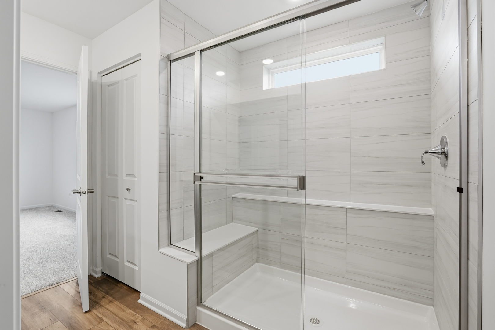 357 Danforth Drive Oswego, IL 60543 - Photo 13 of 22 a bathroom with a glass shower door