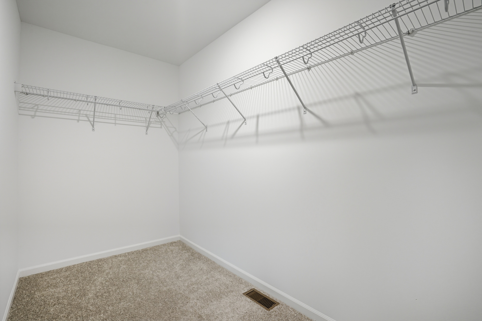 357 Danforth Drive Oswego, IL 60543 - Photo 14 of 22 a view of a room with racks on the wall