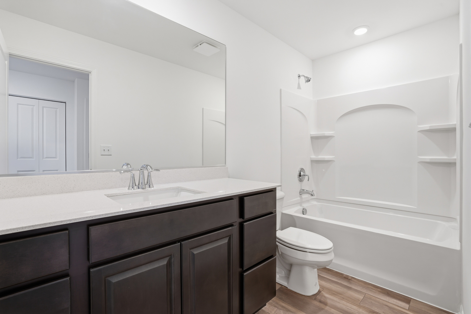 357 Danforth Drive Oswego, IL 60543 - Photo 18 of 22 a bathroom with a granite countertop sink toilet a large mirror and shower