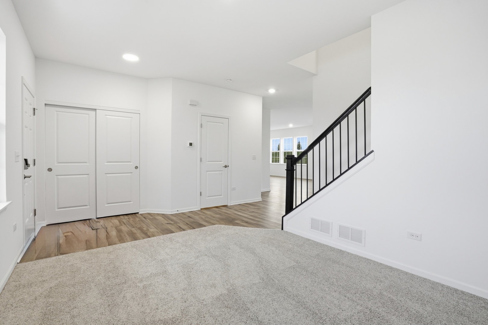 357 Danforth Drive Oswego, IL 60543 - Photo 3 of 22 a view of an empty room with wooden floor