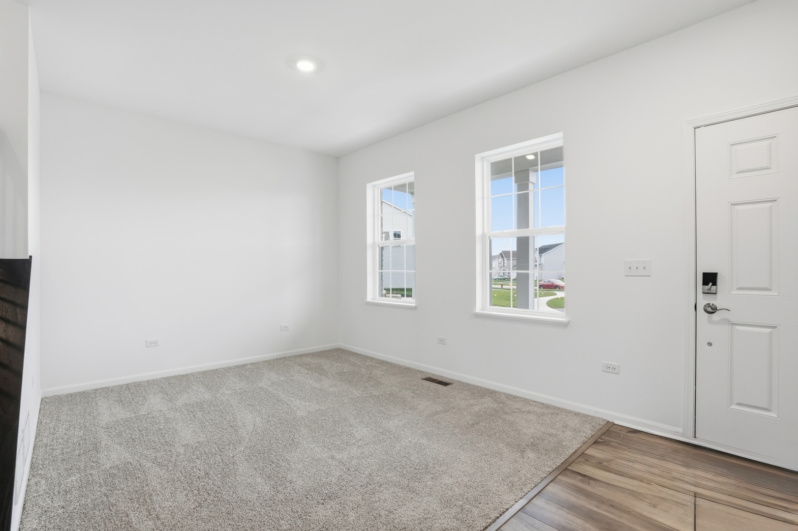 357 Danforth Drive Oswego, IL 60543 - Photo 4 of 22 an empty room with windows