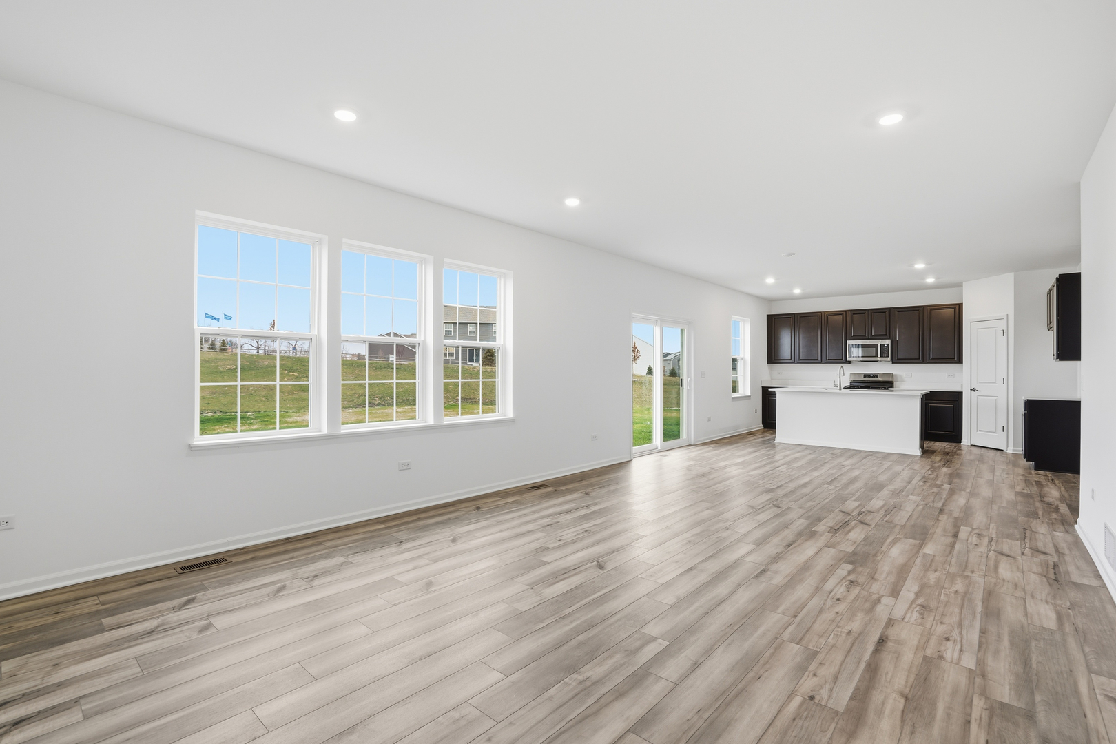 357 Danforth Drive Oswego, IL 60543 - Photo 6 of 22 a view of large kitchen with sink and refrigerator