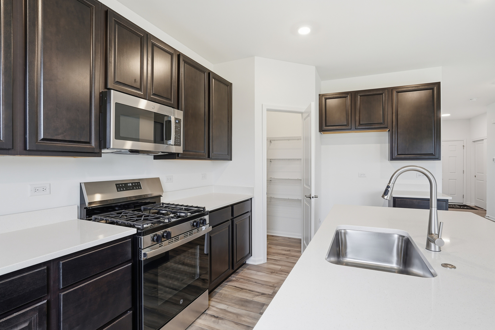 357 Danforth Drive Oswego, IL 60543 - Photo 10 of 22 a kitchen with sink a microwave and cabinets