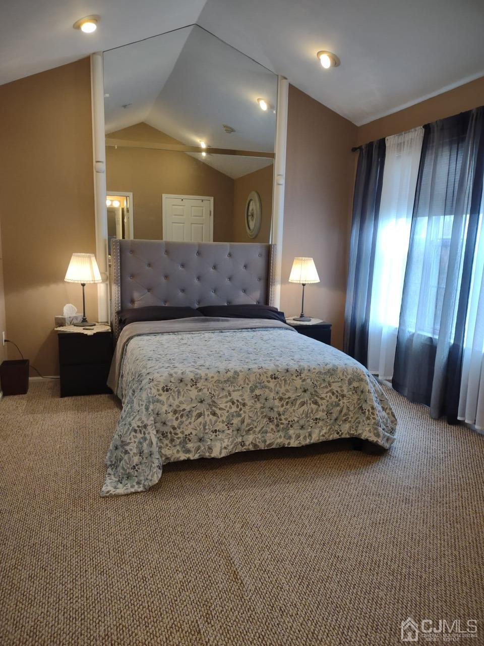 1707 Ridgeview Court Sayreville, NJ 08859 - Photo 19 of 25 a bedroom with a large bed and a lamp
