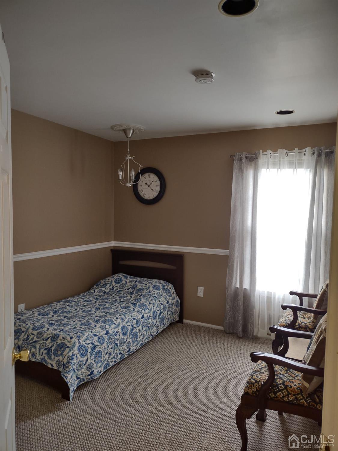 1707 Ridgeview Court Sayreville, NJ 08859 - Photo 24 of 25 a bedroom with a bed and a window