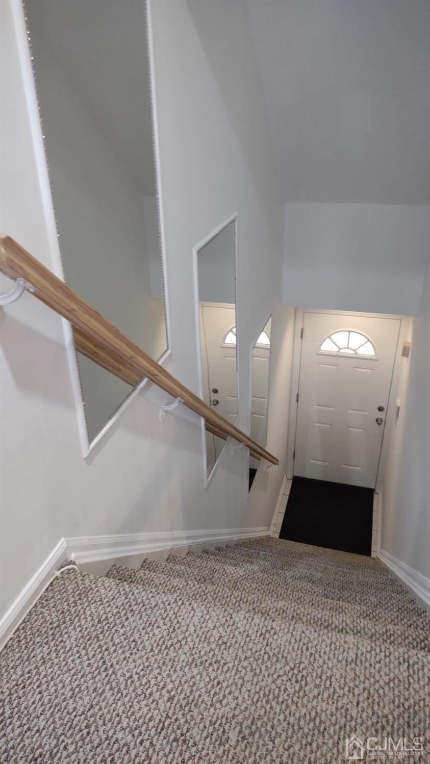 1707 Ridgeview Court Sayreville, NJ 08859 - Photo 7 of 25 a view of a big room with wooden floor and staircase
