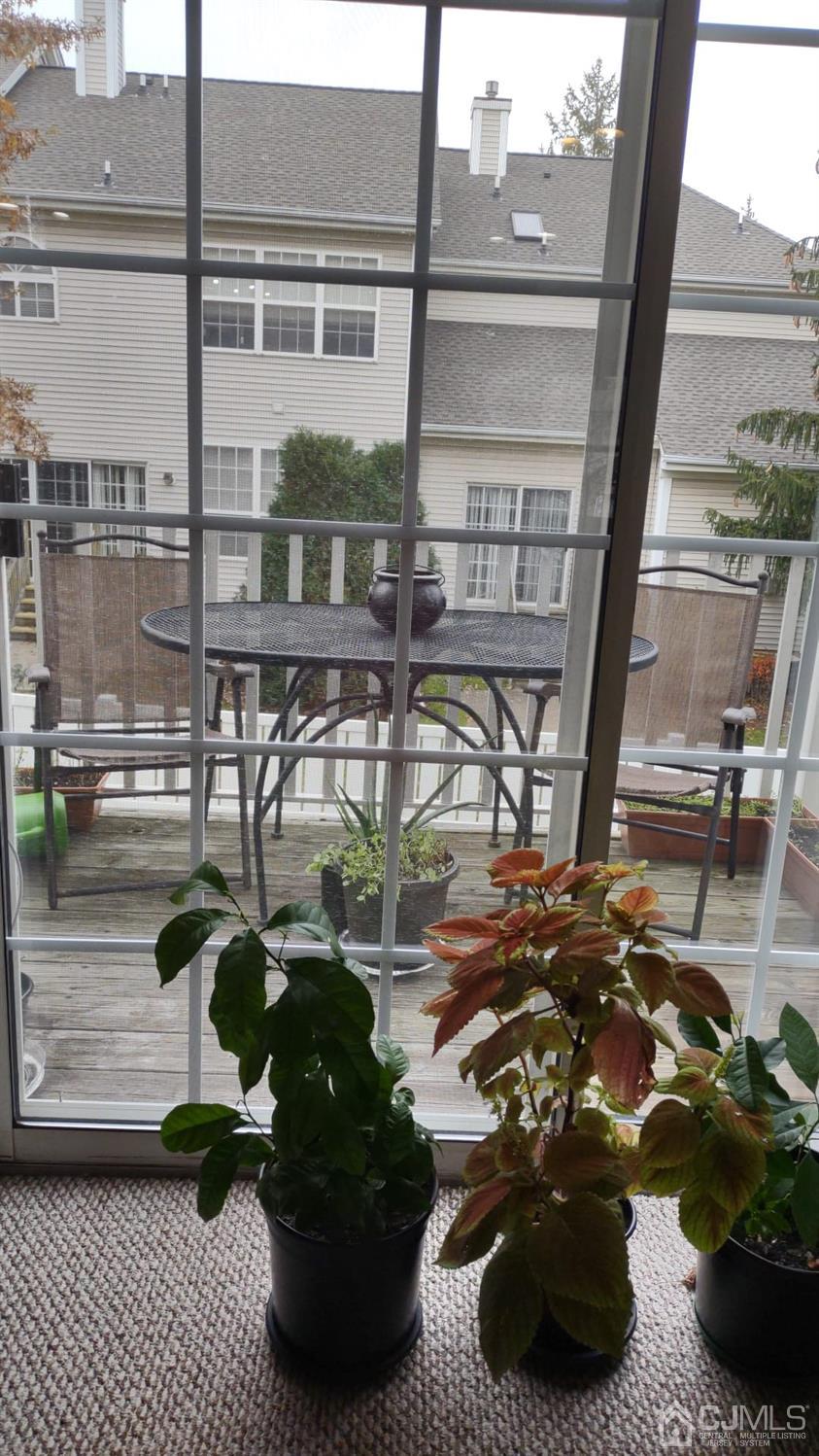 1707 Ridgeview Court Sayreville, NJ 08859 - Photo 8 of 25 a vase of flowers sitting on a table next to a window